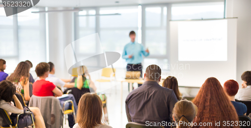 Image of Speaker Giving a Talk at Business Meeting.