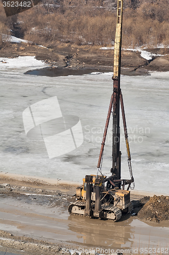Image of Pile driving machine in construction site. Tyumen