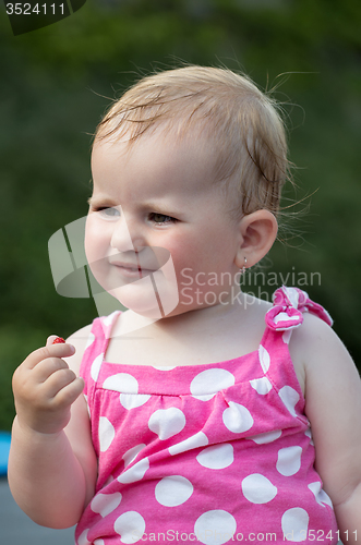 Image of Happy cute little girl outdoor