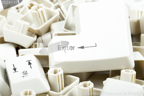 Image of scattered keyboard keys on white 