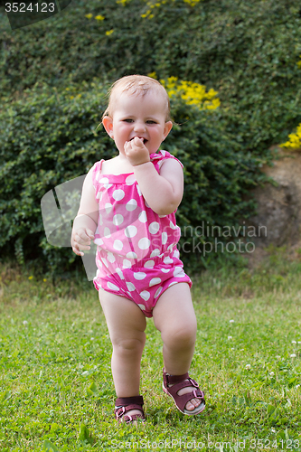 Image of Happy cute little girl outdoor