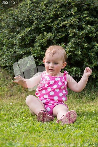 Image of Happy cute little girl outdoor