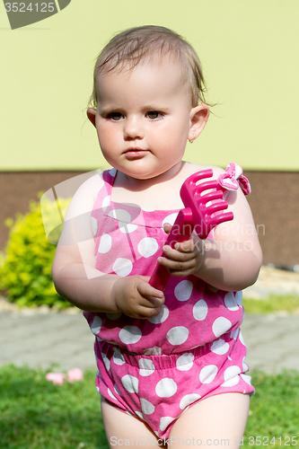 Image of Happy cute little girl outdoor