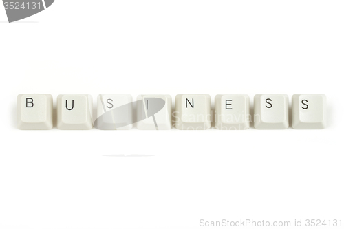 Image of busines from scattered keyboard keys on white