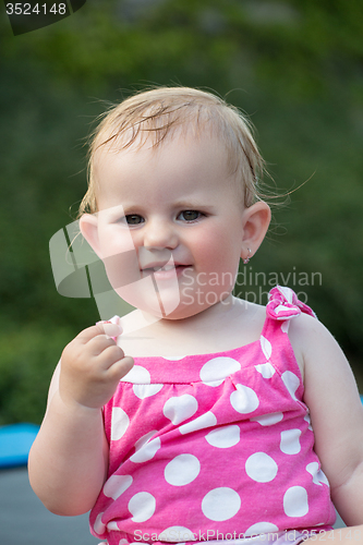 Image of Happy cute little girl outdoor