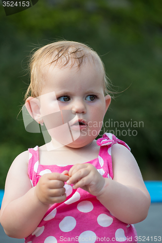 Image of Happy cute little girl outdoor