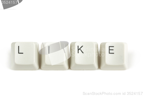 Image of like from scattered keyboard keys on white