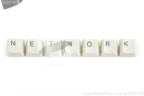 Image of network from scattered keyboard keys on white