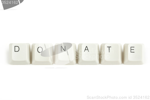 Image of donate from scattered keyboard keys on white