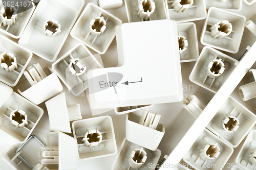 Image of scattered keyboard keys on white 