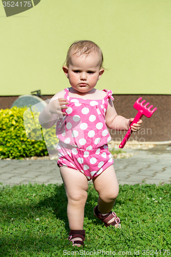 Image of Happy cute little girl outdoor