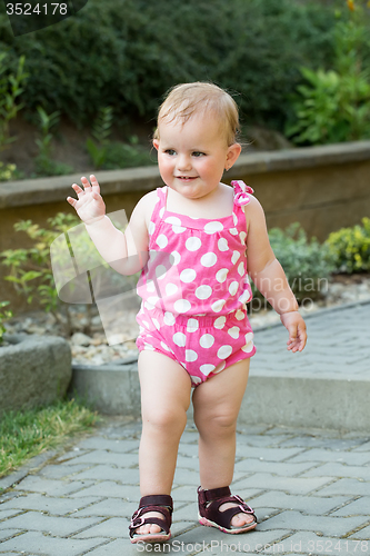 Image of Happy cute little girl outdoor