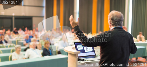 Image of Speaker at Business Conference and Presentation.