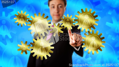 Image of Manager Touching Gear Train Made Of Eight Workers