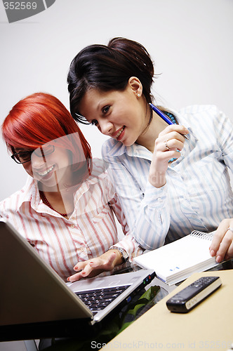 Image of Two businesswomen are working in the office