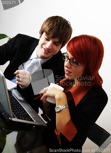 Image of beautiful caucasian business woman with young consultant