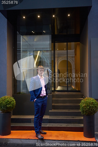 Image of business man entering  hotel