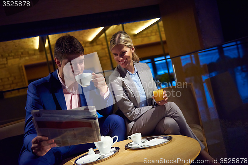 Image of business couple take drink after work