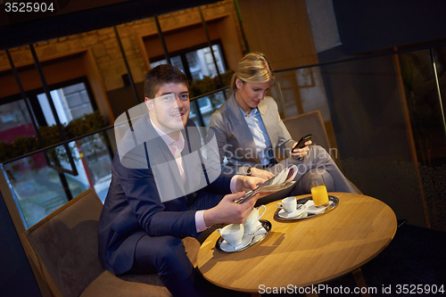 Image of business couple take drink after work