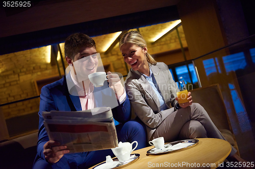 Image of business couple take drink after work