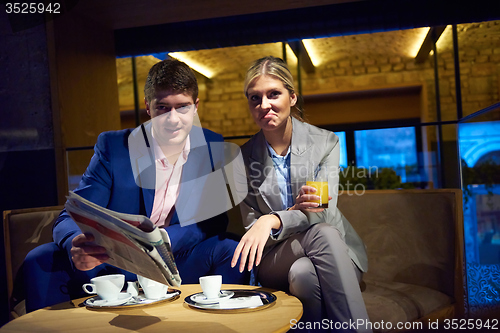 Image of business couple take drink after work