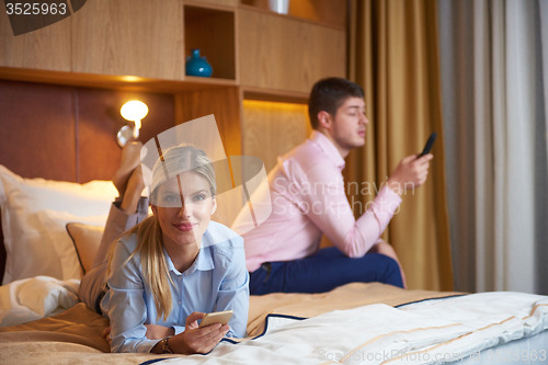 Image of young couple in modern hotel room