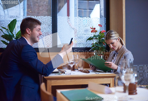 Image of business couple having dinner