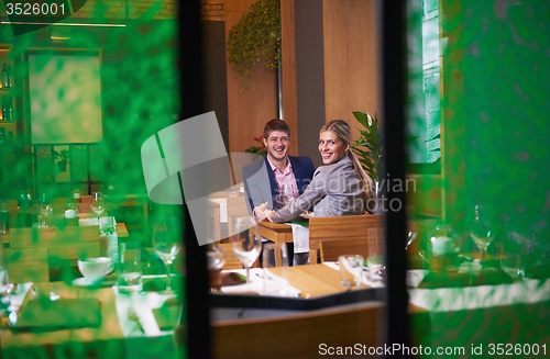 Image of business couple having dinner