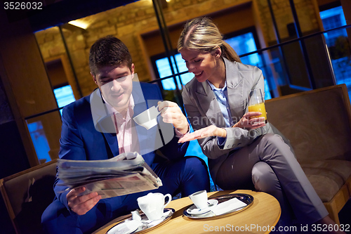 Image of business couple take drink after work