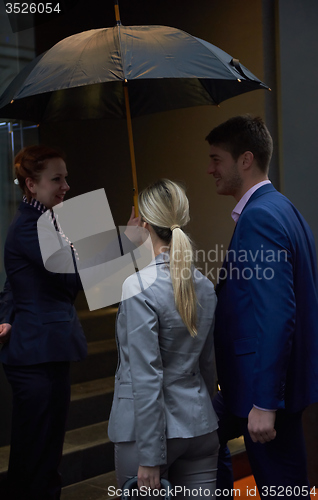 Image of business people couple entering  hotel