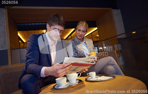 Image of business couple take drink after work