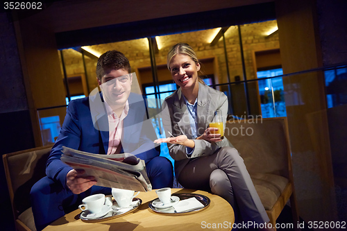 Image of business couple take drink after work