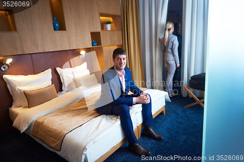 Image of young couple in modern hotel room
