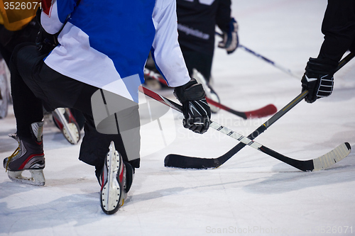 Image of ice hockey players team meeting with trainer