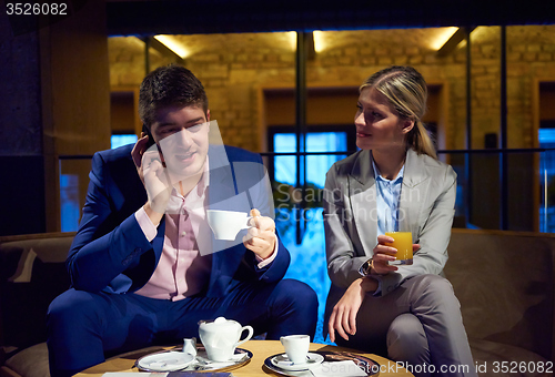 Image of business couple take drink after work