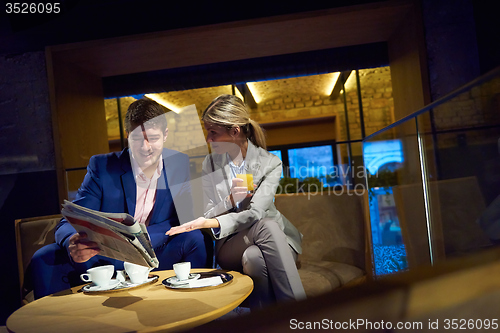 Image of business couple take drink after work