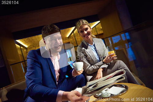 Image of business couple take drink after work