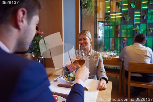 Image of business couple having dinner