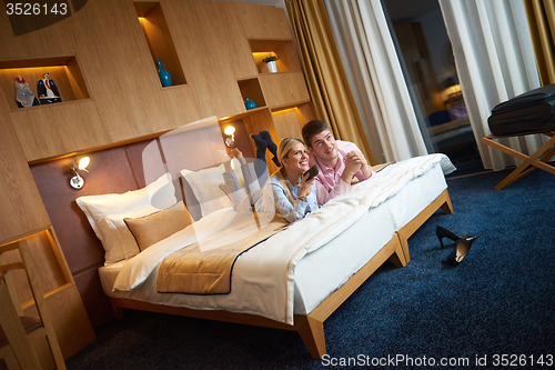 Image of young couple in modern hotel room