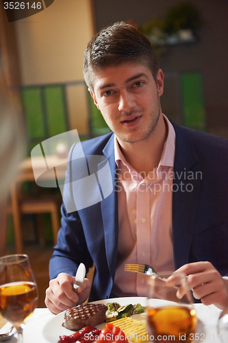 Image of business couple having dinner