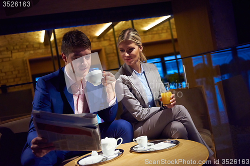 Image of business couple take drink after work