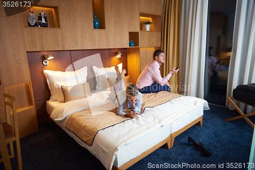 Image of young couple in modern hotel room