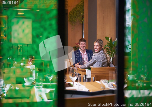 Image of business couple having dinner