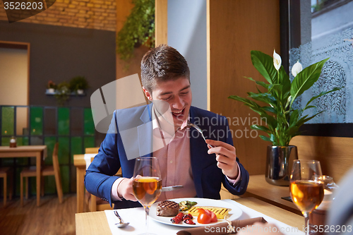 Image of business couple having dinner