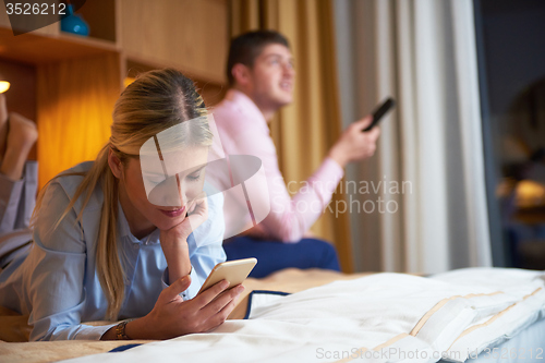Image of young couple in modern hotel room