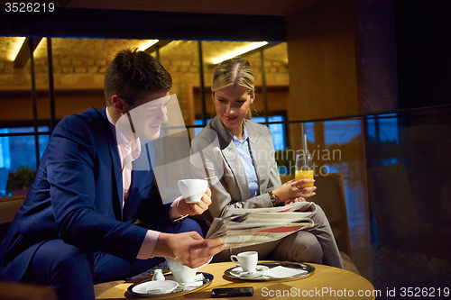 Image of business couple take drink after work