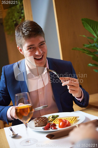 Image of business couple having dinner