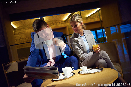 Image of business couple take drink after work