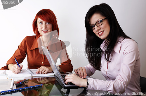 Image of Two businesswomen are working