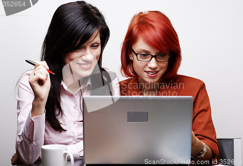 Image of two beautiful women are working